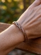BRACCIALE APERTO IN RAME&nbsp;E OTTONE INTRECCIATO TOND